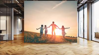 Happy family on autumn walk Wall mural