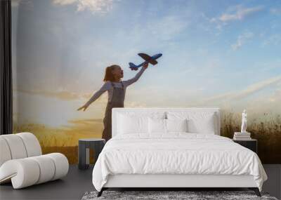 Happy kid with toy plane Wall mural