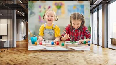 Happy kids are painting at home. Wall mural