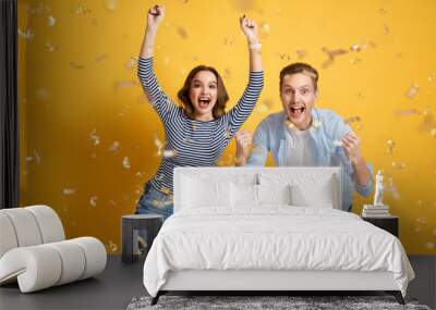 joyful couple on yellow background Wall mural