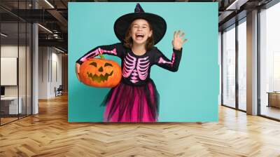 little witch on turquoise background Wall mural