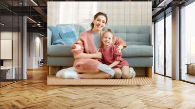 Mom and her daughter smiling and hugging Wall mural