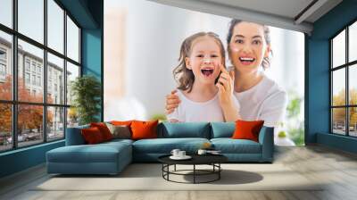 Mother and daughter caring for skin Wall mural