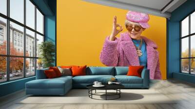 senior woman on color background Wall mural