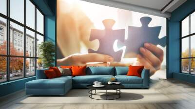 Woman connects couple puzzle piece Wall mural