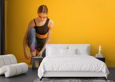 Woman in fashionable sportswear Wall mural