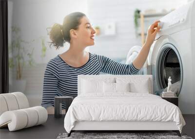 woman is doing laundry Wall mural