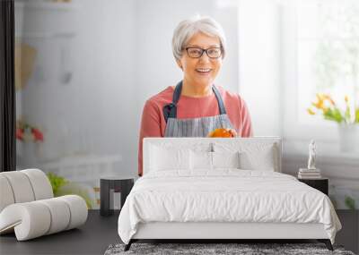 woman is preparing the vegetables Wall mural