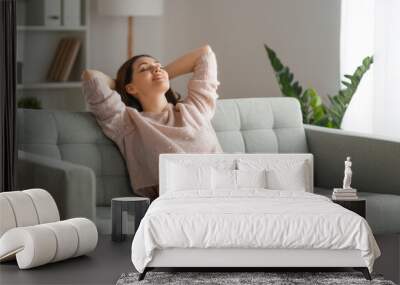 woman resting on a sofa Wall mural