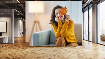 woman resting on sofa at home Wall mural