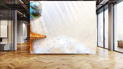 Art Summer Beach background with sunglass and starfish on sand; Tropical sea vacation concept Wall mural