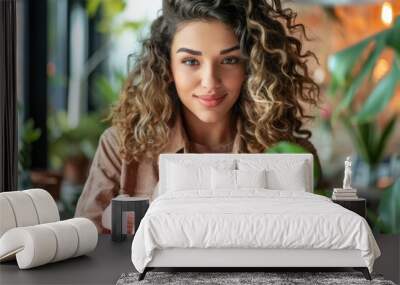 A confident woman holds a piggy bank in her hands, her determined expression showcasing her commitment to financial security and smart saving habits Wall mural