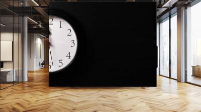 Clock on a black background. A minute to twelve. Banner. Place for your text. Wall mural