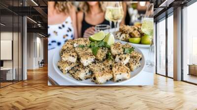 Delicious crispy tofu bites with fresh lime on a plate at a social event Wall mural