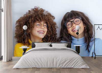 Happy Kids with Curly and Straight Hair Wearing Glasses and Colorful Sweaters Smiling Together Wall mural