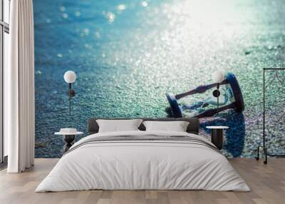 Hourglass in the water by the sea, ocean. Wall mural