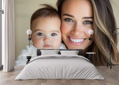 Joyful mother and baby smiling together in close-up portrait Wall mural