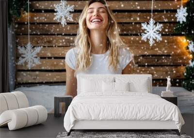 Joyful woman meditating in snowy winter wonderland indoors Wall mural