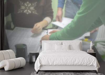 Papers and people's hands in the office in a blurry. Wall mural