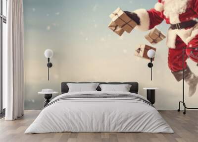 Santa Claus flies with gifts against the sky. Banner, place for text. Wall mural