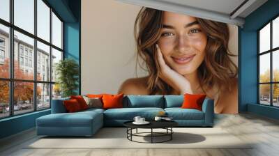 Serene radiance: A woman's captivating smile and relaxed demeanor showcase her inner and outer beauty against a warm backdrop. Wall mural