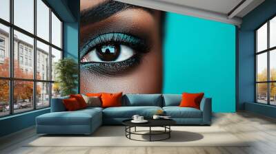 Closeup of a model s eye with bold makeup, black studio background, beauty and intensity Wall mural