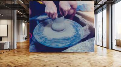 pottery, workshop, ceramics art concept - closeup on male hands sculpt new utensil with a tools and water Wall mural