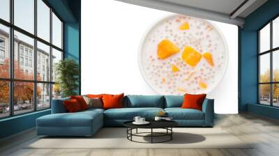 A bowl of sweet sago cream with mango and coconut milk on white background.Top view. Wall mural