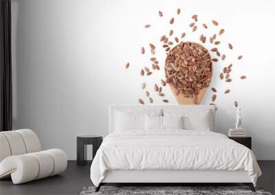 Flax seeds in a wooden spoon on white background Wall mural