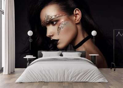 Beautiful woman with bronse futuristic make up Wall mural