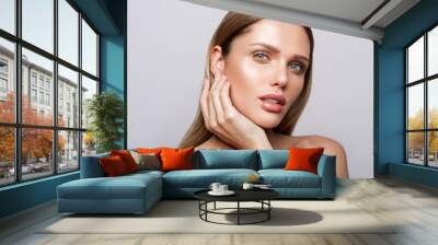 Beauty portrait of model with natural make-up. Fashion shiny highlighter on skin, sexy gloss lips make-up Wall mural