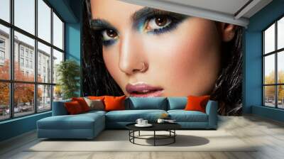 Beautyful girl with blue glitter on her face Wall mural