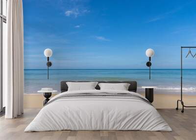 Ocean view and white sand beach with blue sky and a tiny wave background Wall mural