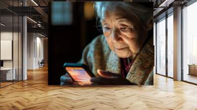 A woman is looking at her cell phone Wall mural