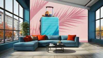 summer vacation and travel concept. luggage hat and sunglasses. pink and blue background with empty  Wall mural