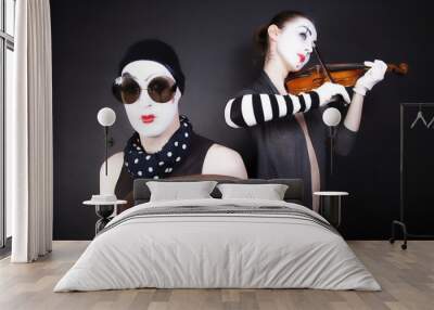 Two mimes playing a violin for the money Wall mural