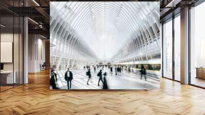 Train station with people walking around with motion blur, white ceiling lines and glass windows, train passing Wall mural