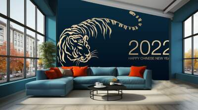 Happy Chinese New Year 2022 by gold brush stroke abstract paint of the tiger isolated on dark blue background. Wall mural