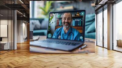 A man in a blue scrubs is on a laptop screen Wall mural