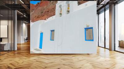 Greece Santorini island in Cyclades, traditional view of white washed houses with colorful wooden frames Wall mural