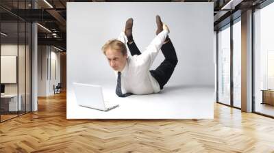 Young businessman yoga before an open notebook Wall mural