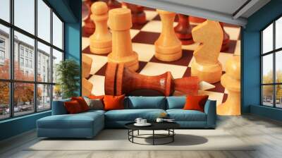 Wooden chess pieces on a chessboard Wall mural