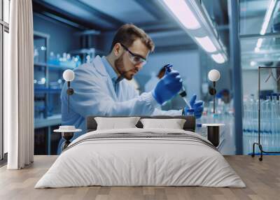 A scientist in laboratory is carefully conducting experiments with test tubes and pipettes, showcasing precision and focus in modern research environment Wall mural