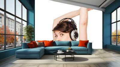 active cheerful woman with headphones posing on a white backgrou Wall mural