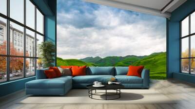 Blue beautiful clouds over the green picturesque mountains of Armenia Wall mural