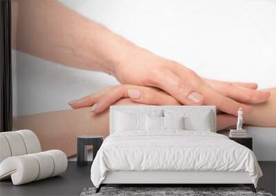 hand massage in the salon of a physiotherapist on a white backgr Wall mural