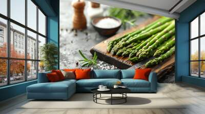 fresh asparagus spears on a cutting board. Healthy and wholesome cooking. Wall mural