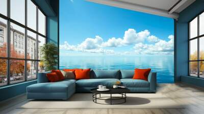 Tranquil ocean waters mirroring the clear blue sky Wall mural