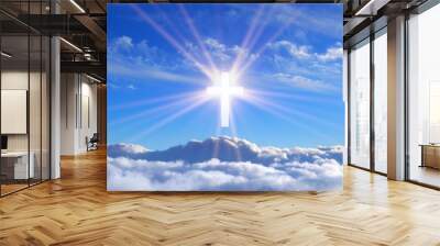 religious cross over cumulus clouds illuminated by the rays of holy radiance, concept Wall mural