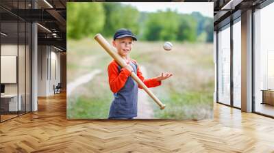 A Happy child with baseball bat on nature concept in park Wall mural